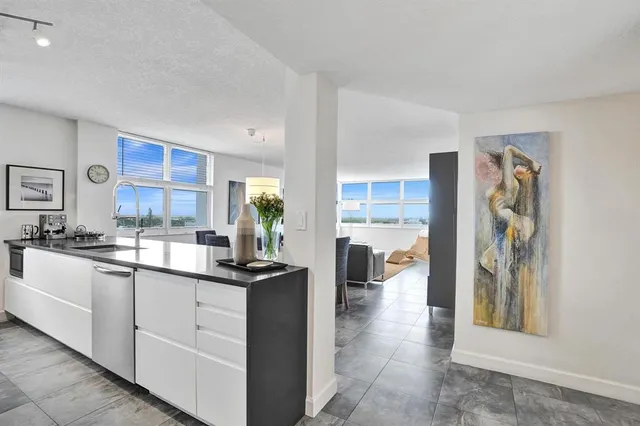 a stove top oven sitting inside of a kitchen