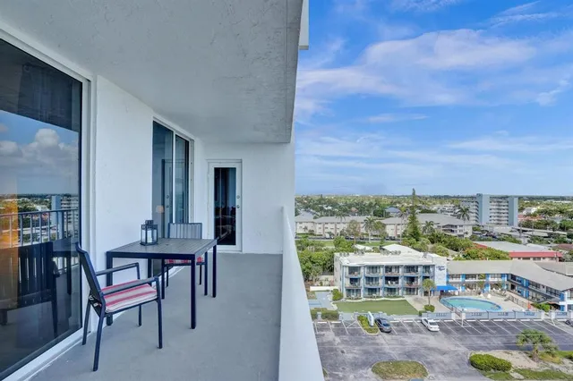 a view of a street with a building in the background