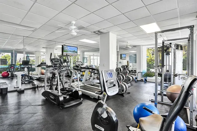 an outdoor space with patio and white umbrellas