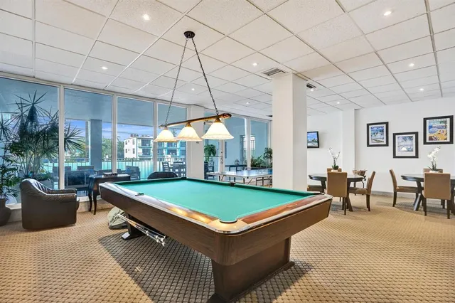 a view of a patio with table and chairs and wooden floor