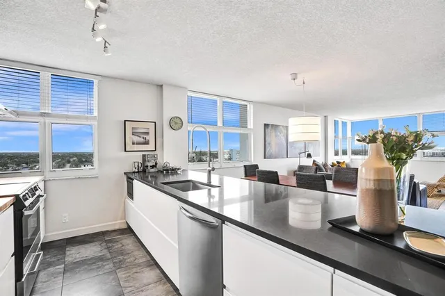 a kitchen with a stove and a window