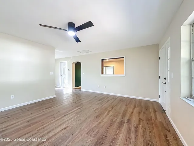 a kitchen with cabinets stainless steel appliances and a counter space