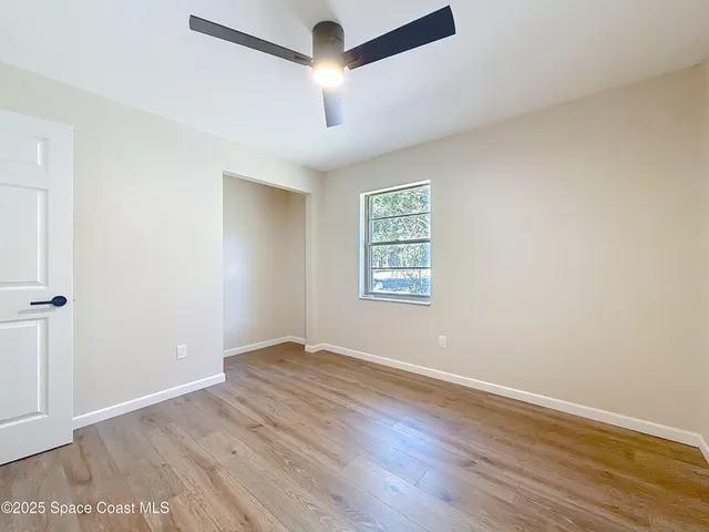 a bathroom with a sink a toilet and a large mirror