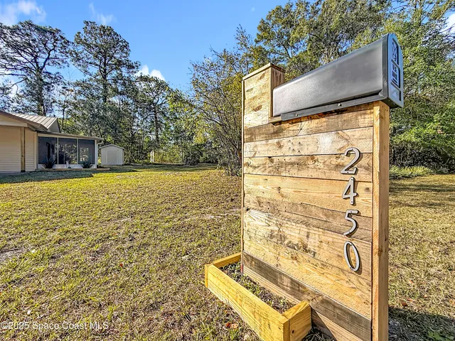 a house view with swimming pool in front of it