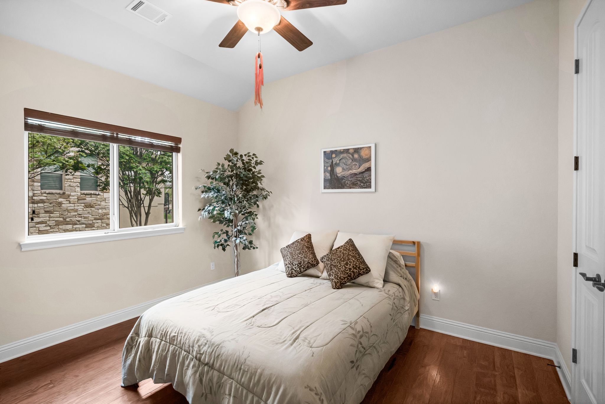 212 Tavish Trail Austin, TX 78738 - Photo 17 of 32 a bedroom with bed and window