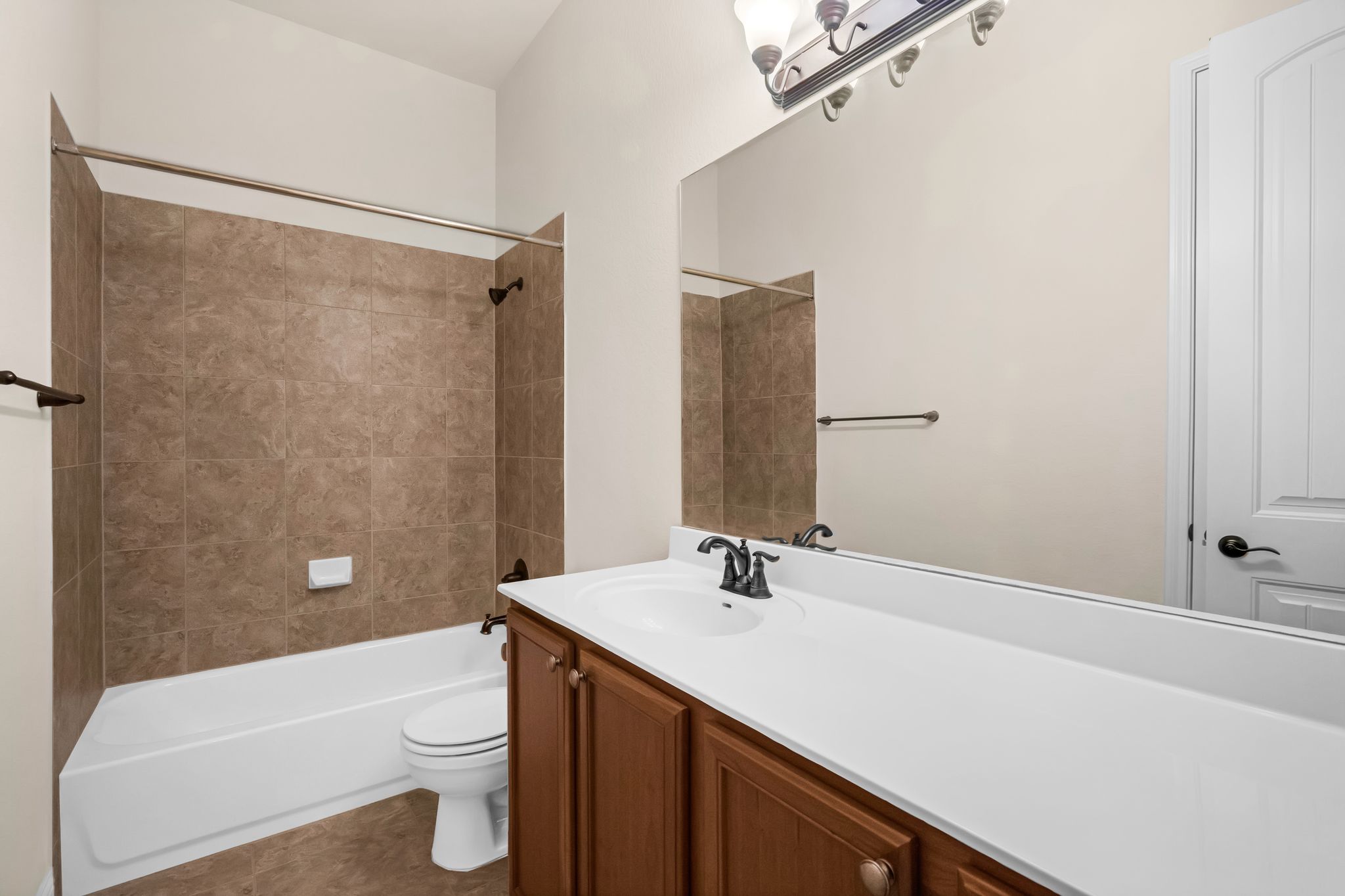212 Tavish Trail Austin, TX 78738 - Photo 22 of 32 a bathroom with a sink a toilet and shower