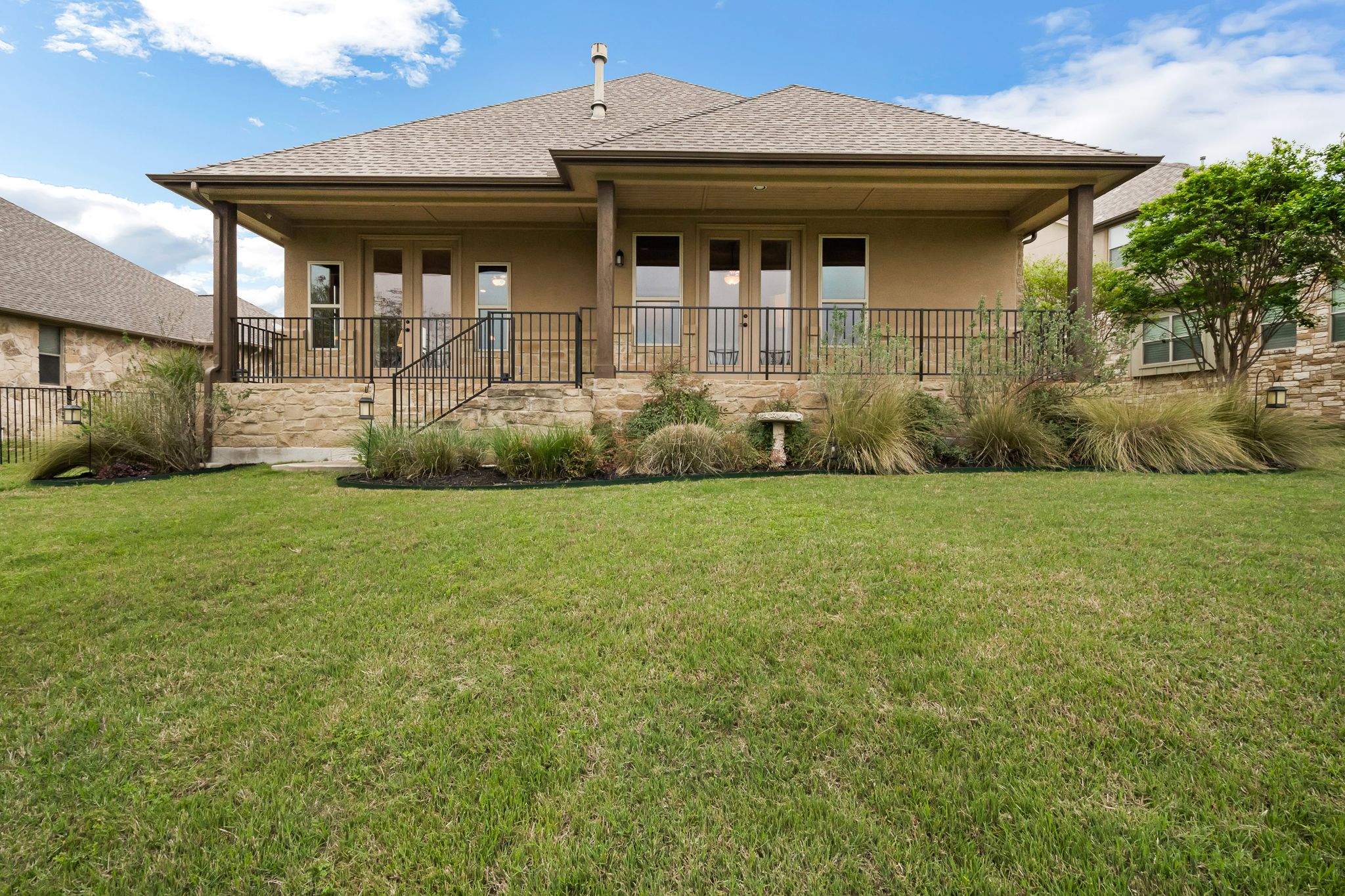 212 Tavish Trail Austin, TX 78738 - Photo 31 of 32 a front view of a house with a yard
