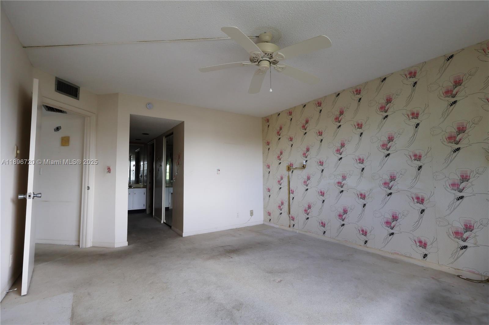 1705 Andros Isle, Unit E3 Coconut Creek, FL 33066 - Photo 12 of 17 a view of an empty room