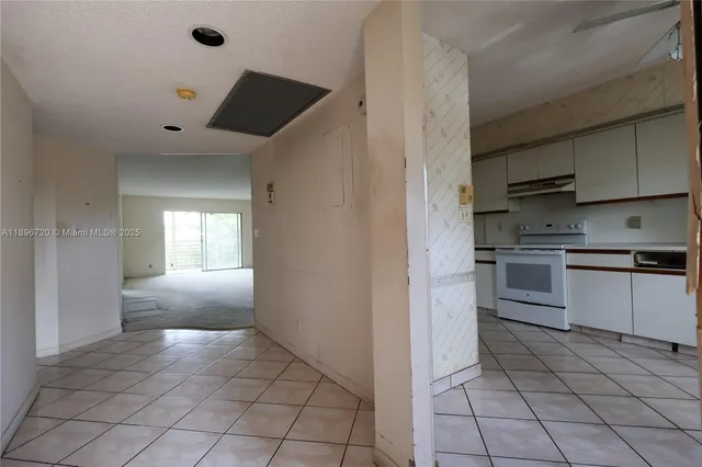 a kitchen with cabinets and appliances