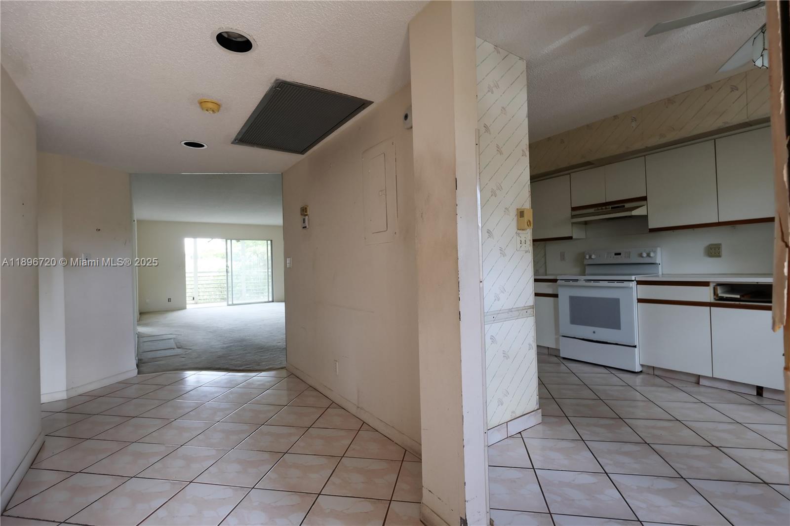 1705 Andros Isle, Unit E3 Coconut Creek, FL 33066 - Photo 2 of 17 a kitchen with cabinets and appliances