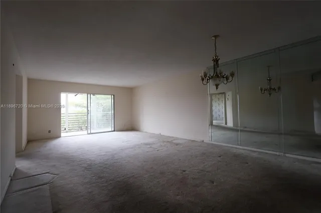 a view of empty room with windows