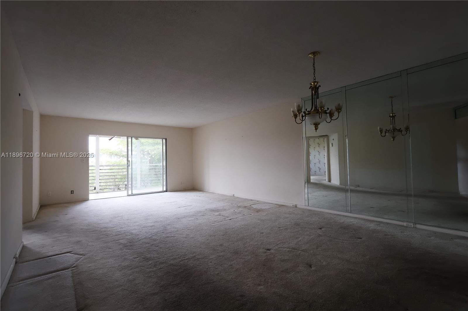 1705 Andros Isle, Unit E3 Coconut Creek, FL 33066 - Photo 6 of 17 a view of empty room with windows
