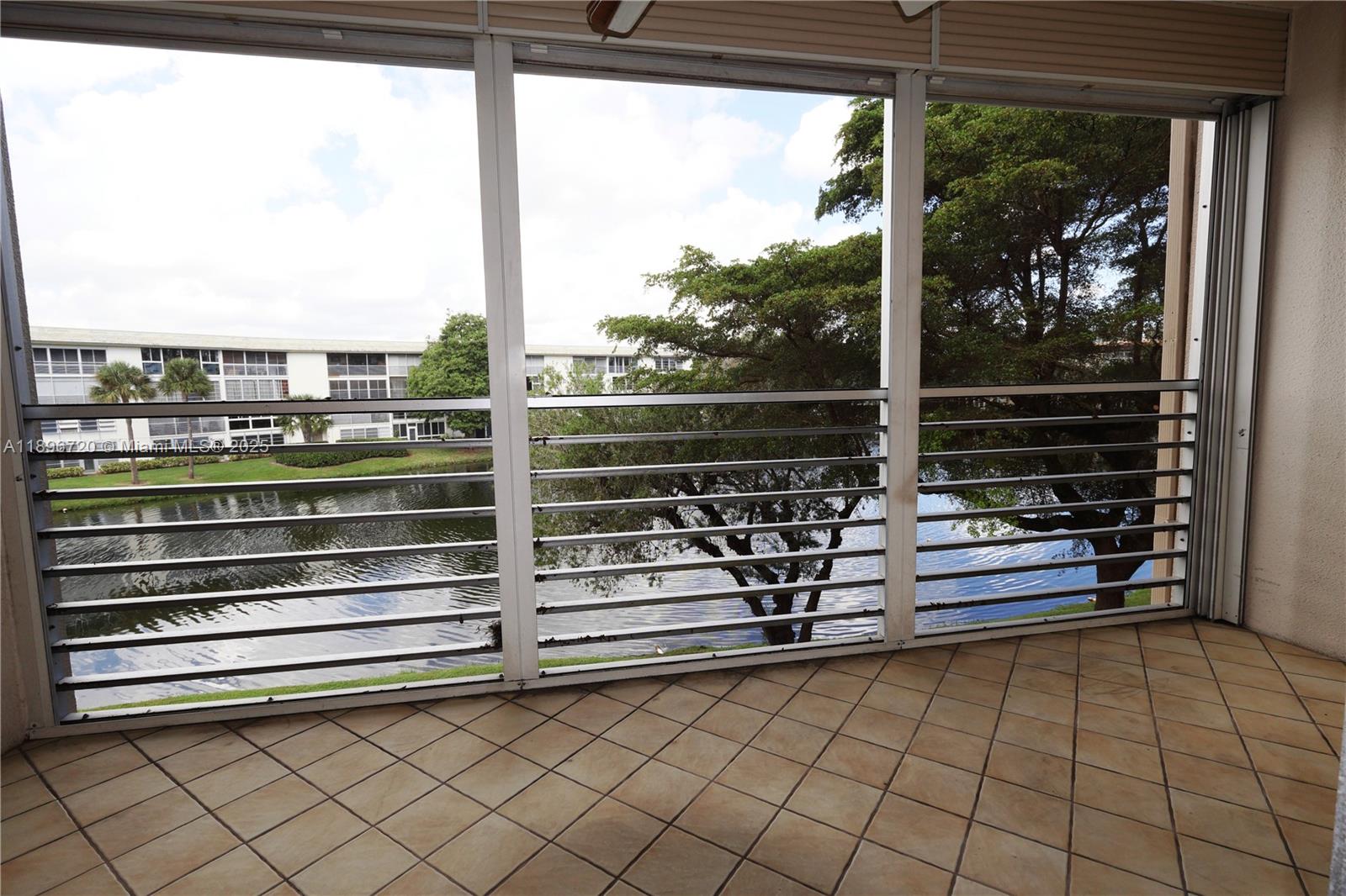 1705 Andros Isle, Unit E3 Coconut Creek, FL 33066 - Photo 8 of 17 a view of outdoor space with seating area