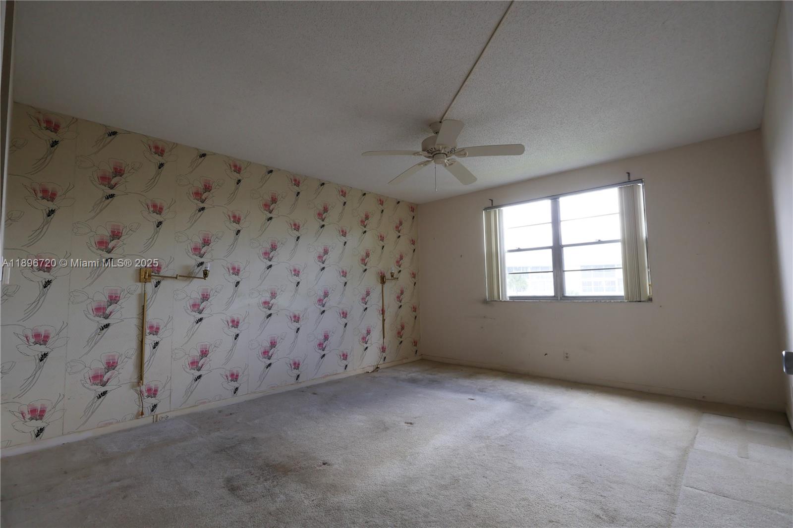 1705 Andros Isle, Unit E3 Coconut Creek, FL 33066 - Photo 10 of 17 a view of an empty room with a window