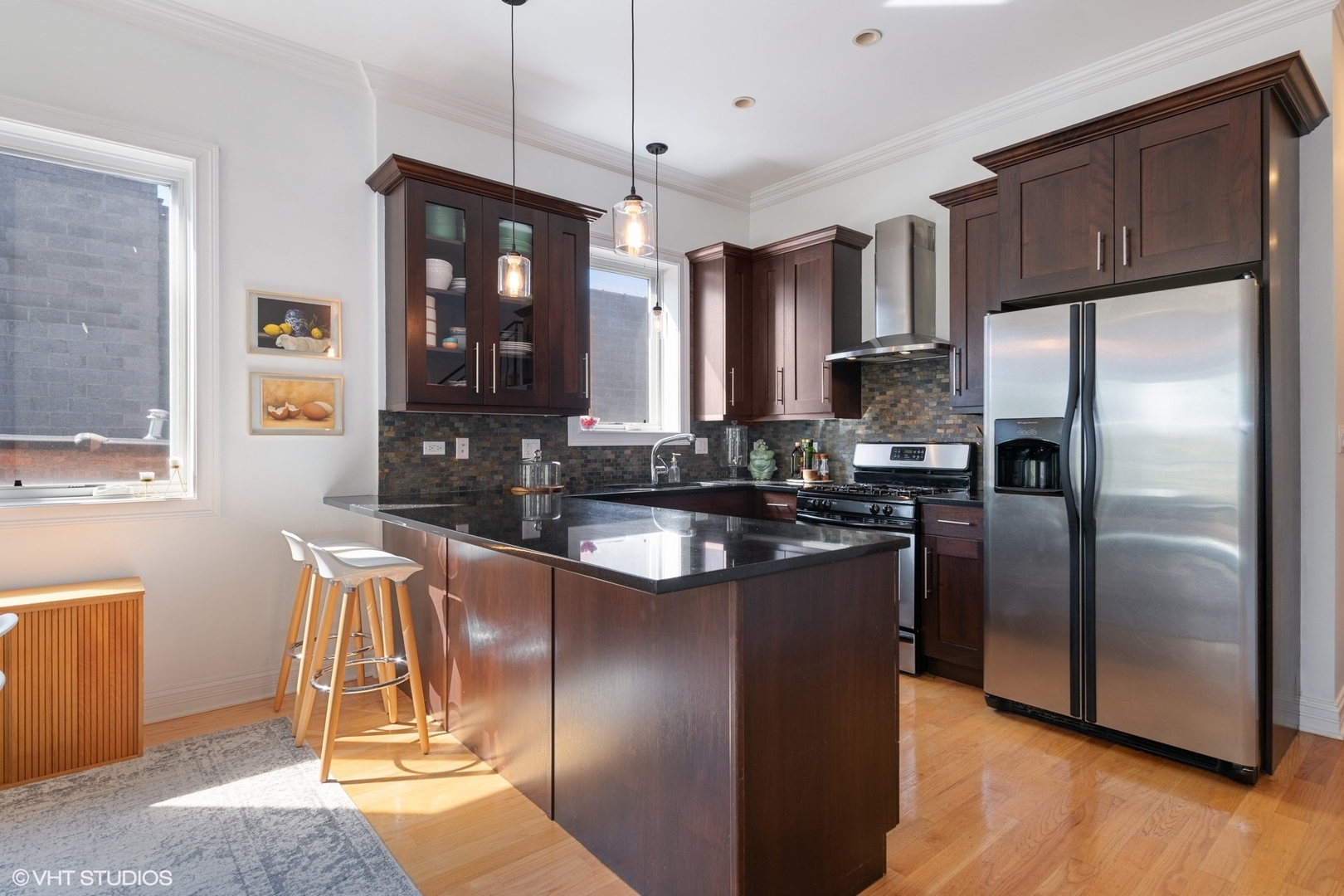2642 West Cortez Street, Unit 3 Chicago, IL 60622 - Photo 11 of 19 a kitchen with stainless steel appliances granite countertop a refrigerator a stove a sink and a microwave