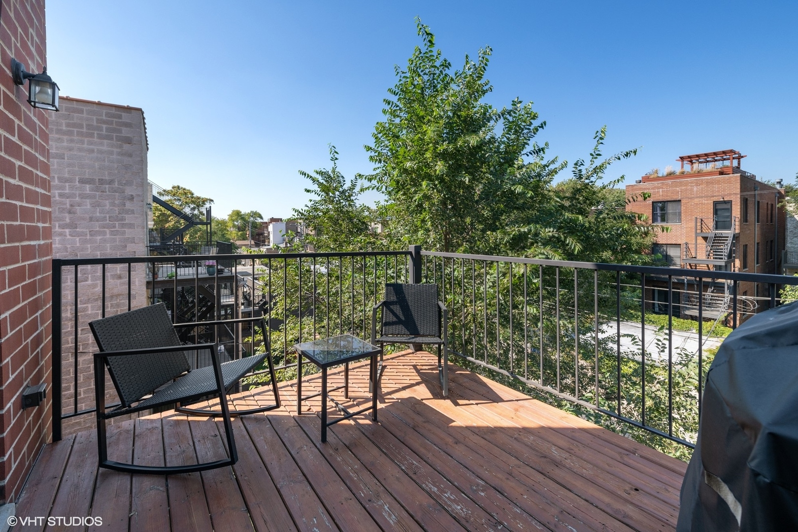 2642 West Cortez Street, Unit 3 Chicago, IL 60622 - Photo 17 of 19 a view of a balcony with wooden floor and outdoor seating