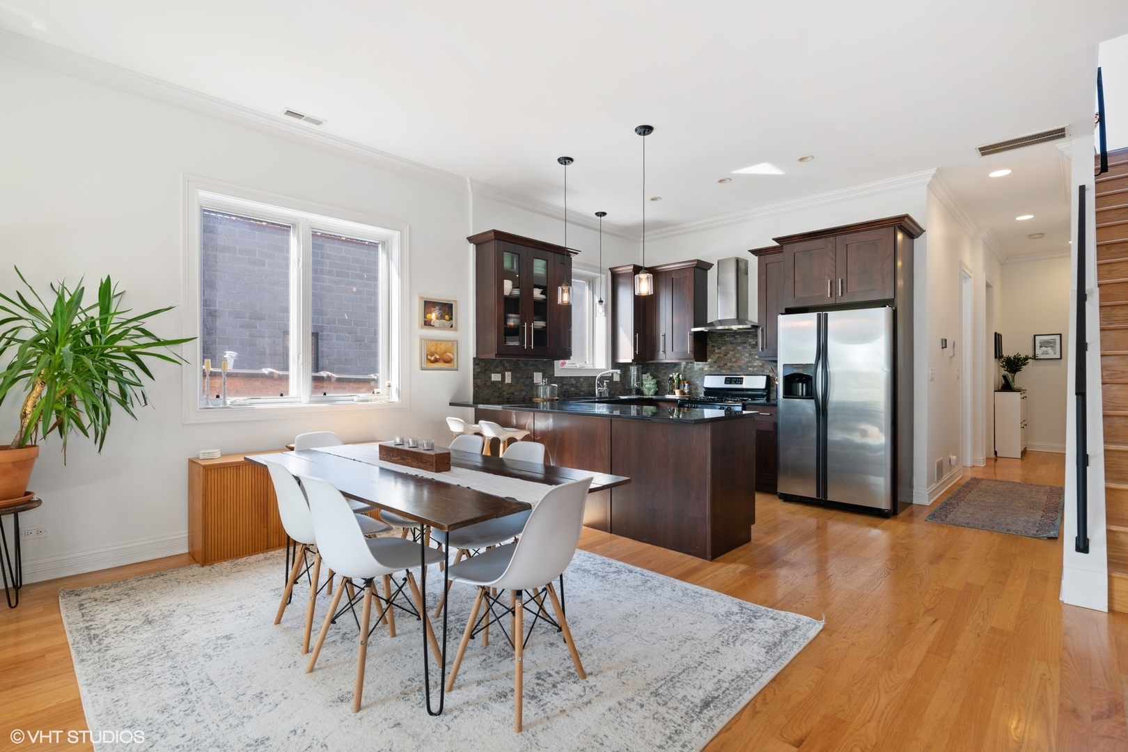 2642 West Cortez Street, Unit 3 Chicago, IL 60622 - Photo 8 of 19 a kitchen with a refrigerator a counter top space and a center island