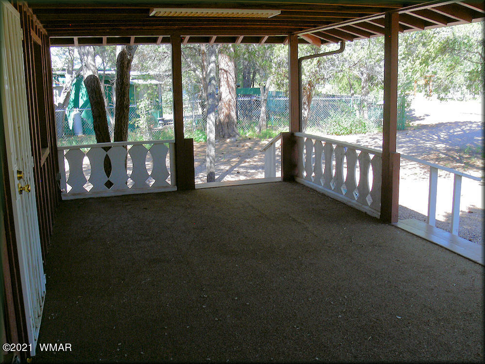 2179 Chevelon Road Overgaard, AZ 85933 - Photo 3 of 11 a view of a room with porch and wooden floor