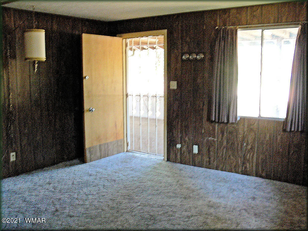 2179 Chevelon Road Overgaard, AZ 85933 - Photo 9 of 11 a view of a bathroom with a window and a bathroom