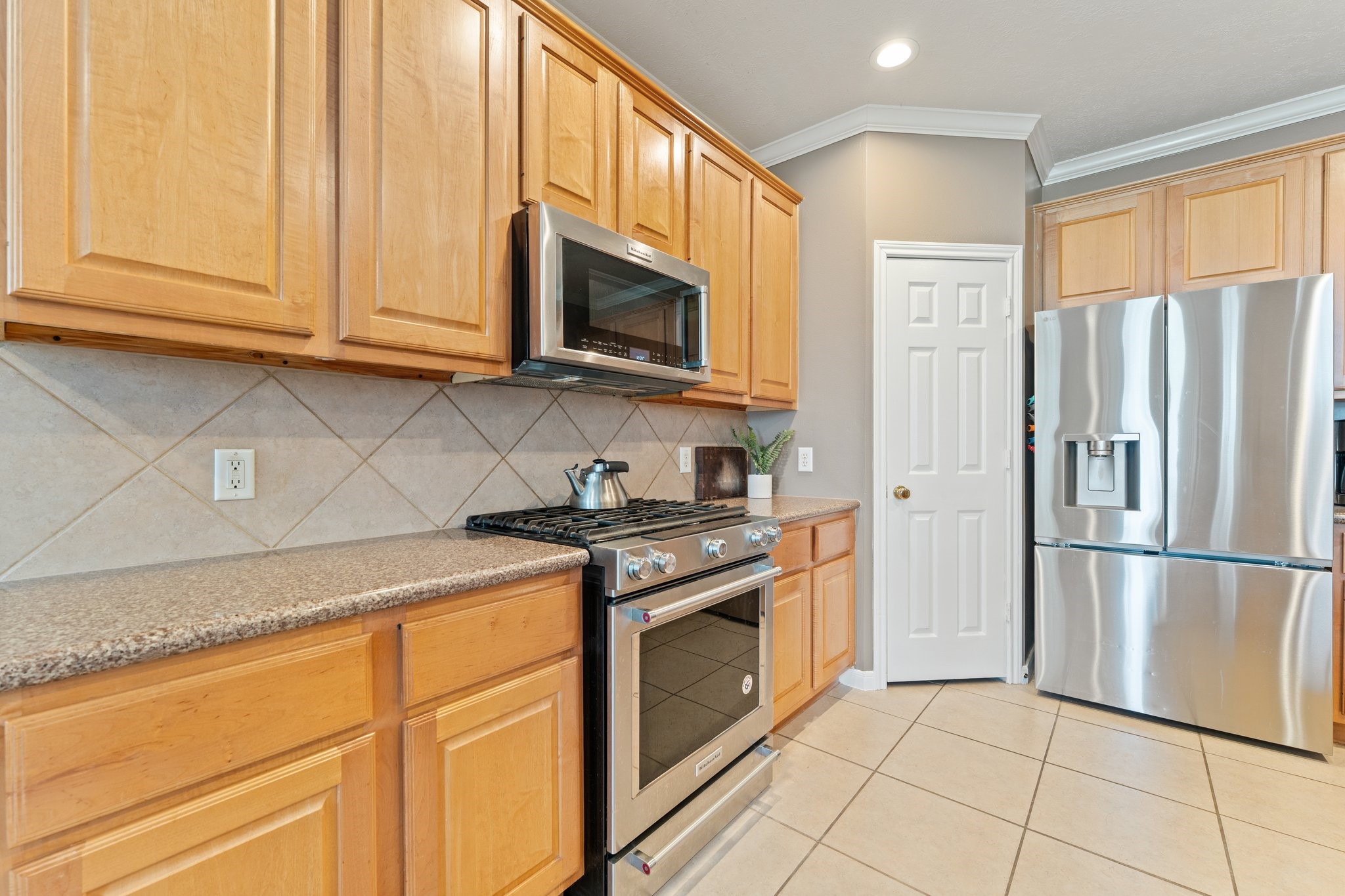 25447 China Springs Spring, TX 77373 - Photo 8 of 45 A clean, functional kitchen designed for real living, with a space that becomes the natural gathering spot during meals and every day moments.