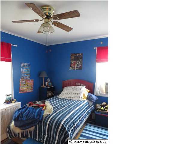530 Newman Springs Road Lincroft, NJ 07738 - Photo 14 of 21 a bedroom with a bed and a chandelier