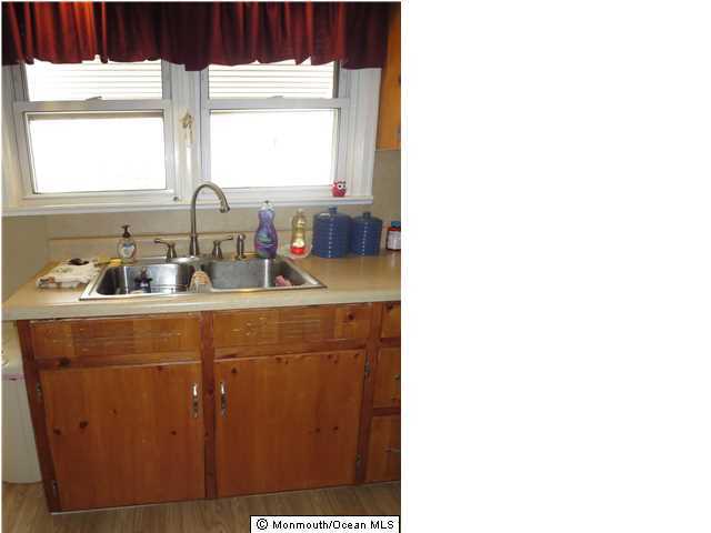 530 Newman Springs Road Lincroft, NJ 07738 - Photo 4 of 21 a bathroom with a sink and a mirror