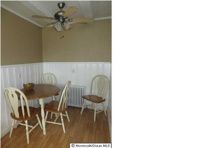530 Newman Springs Road Lincroft, NJ 07738 - Photo 5 of 21 a view of a dining room with furniture and wooden floor