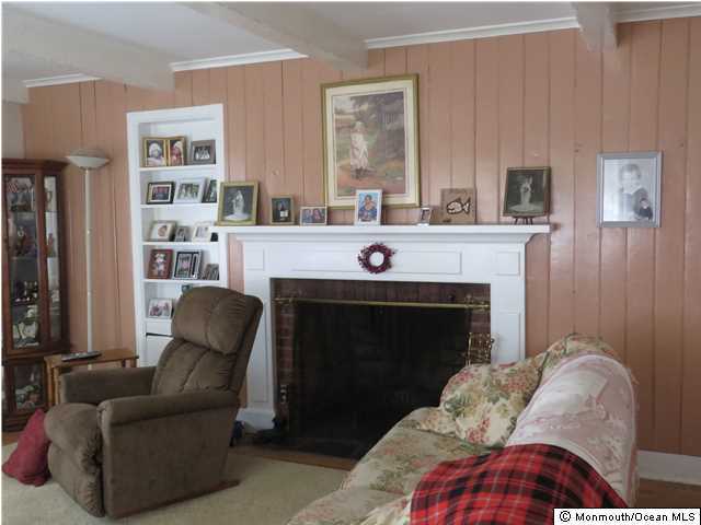 530 Newman Springs Road Lincroft, NJ 07738 - Photo 8 of 21 a living room with furniture and a fireplace
