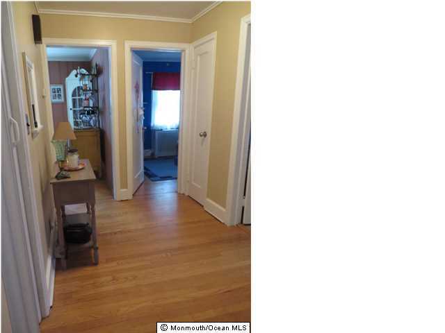 530 Newman Springs Road Lincroft, NJ 07738 - Photo 10 of 21 a view of a hallway with wooden floor