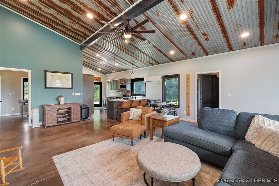 Enter living room from garage through mud room beh