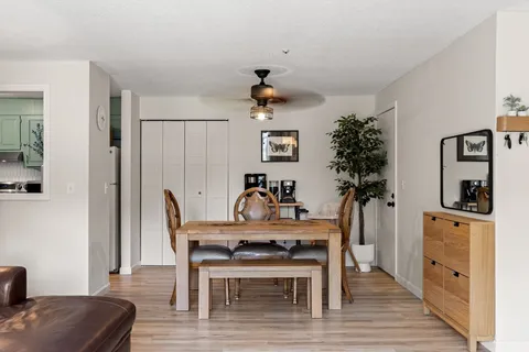 a dining room with furniture and window