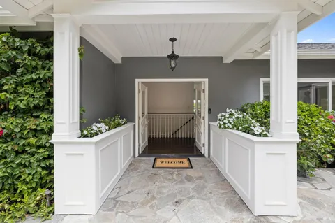 a swimming pool with outdoor seating and yard