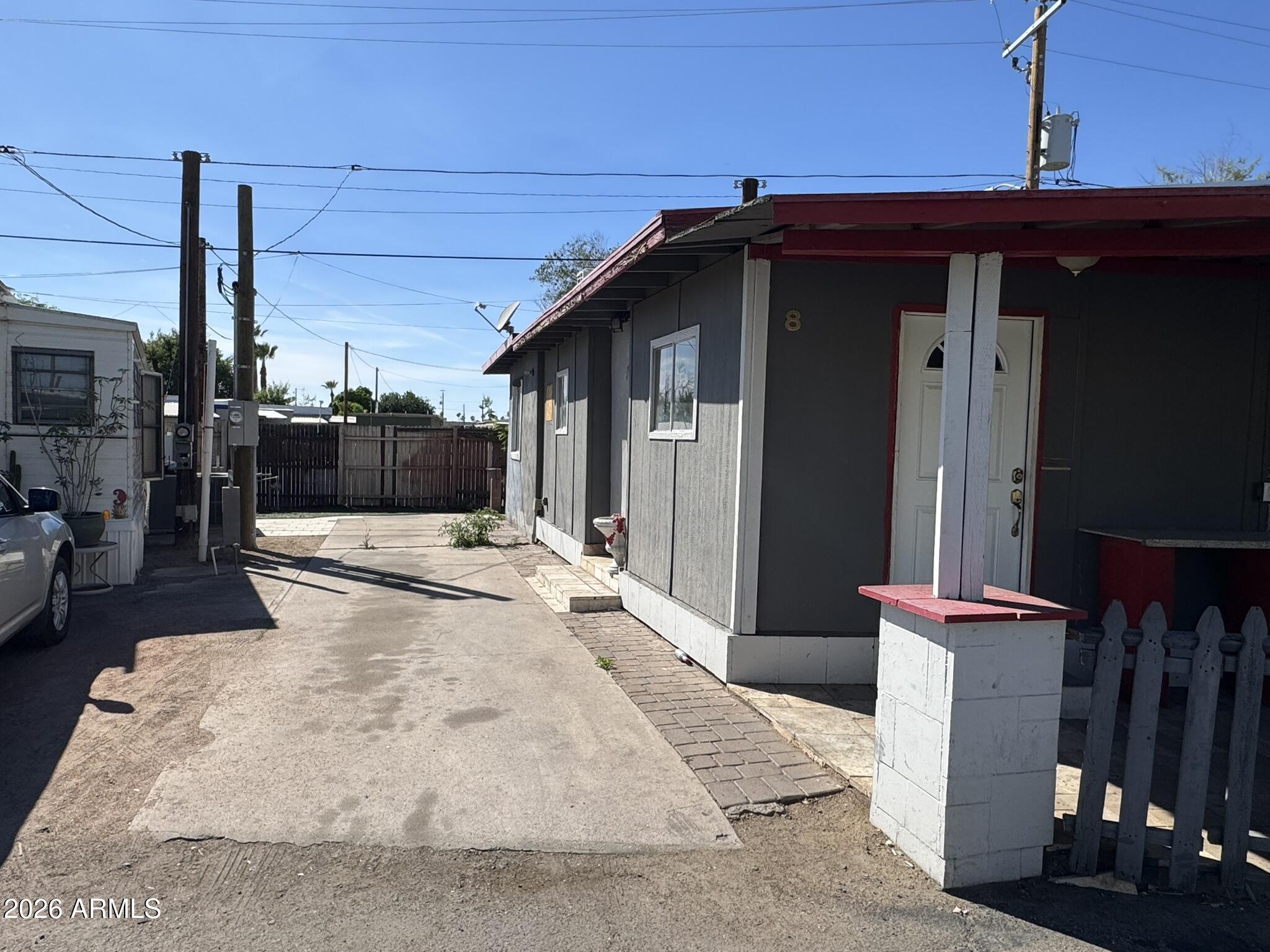 a view of a porch with a table and chairs