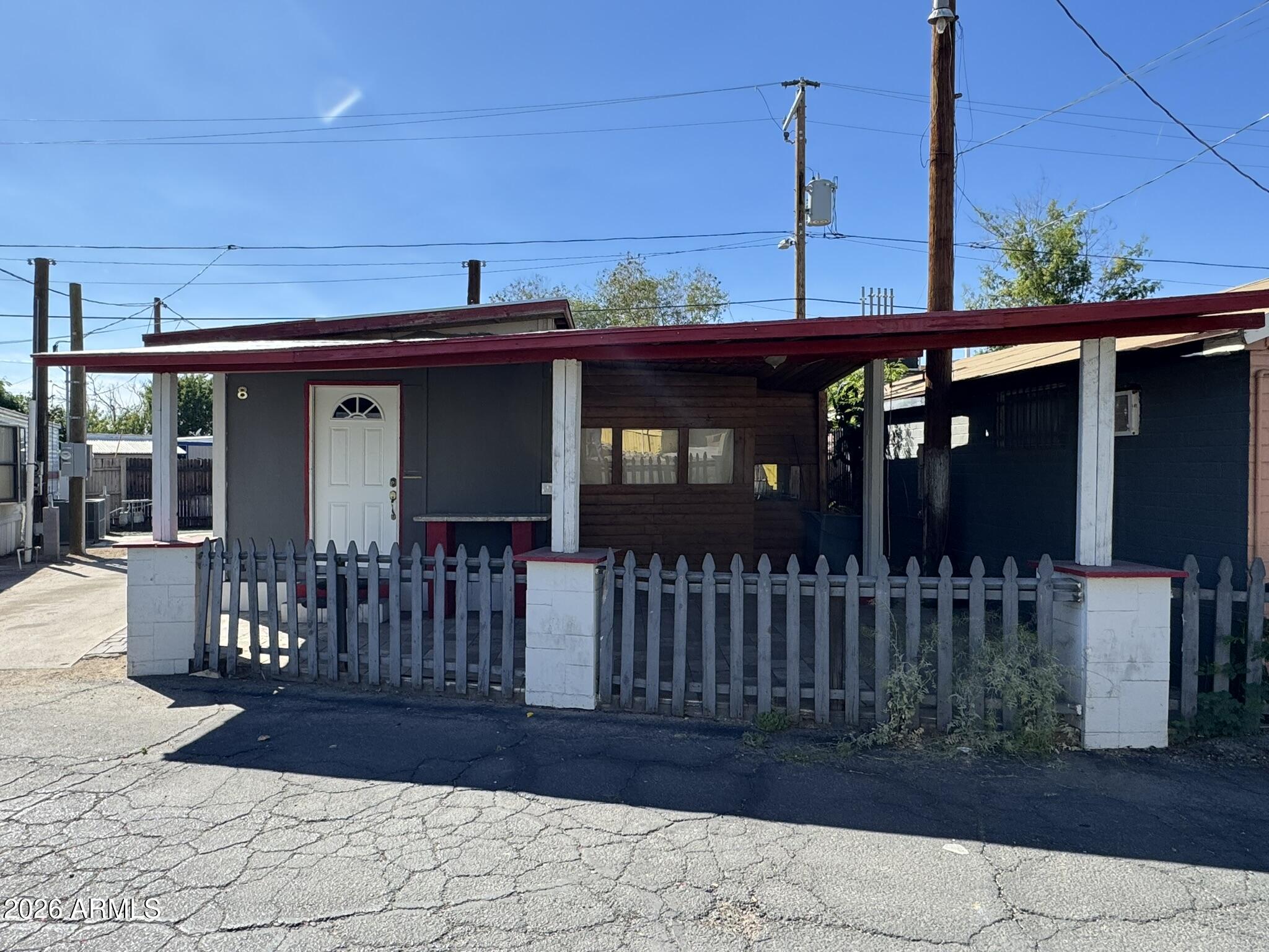3140 West Osborn Road, Unit 8 Phoenix, AZ 85017 - Photo 2 of 13 a view of a house with a porch