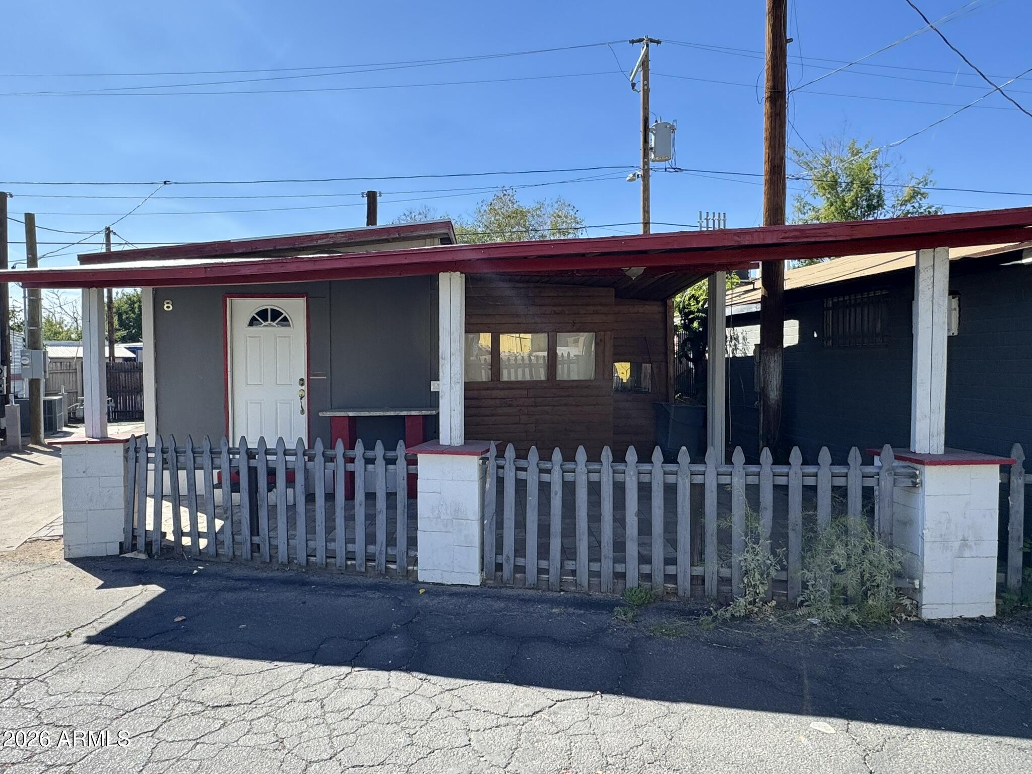 3140 West Osborn Road, Unit 8 Phoenix, AZ 85017 - Photo 3 of 13 a view of a house with a porch