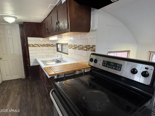 a kitchen with a stove and a microwave