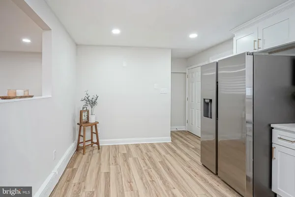 a kitchen with stainless steel appliances granite countertop a refrigerator sink and microwave