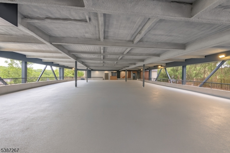 391 Springfield Avenue, Unit 3J Berkeley Heights, NJ 07922 - Photo 6 of 9 a view of an empty room with a sliding door