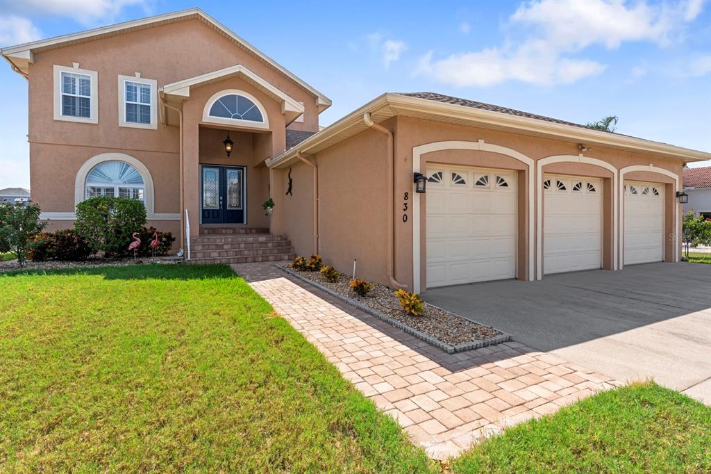 830 Golf Island Drive Apollo Beach, FL 33572 - Photo 20 of 87 a front view of a house with garden