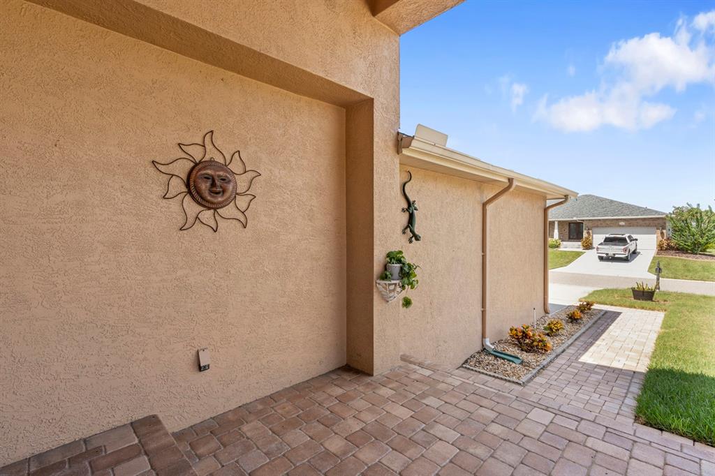 830 Golf Island Drive Apollo Beach, FL 33572 - Photo 22 of 87 a front view of a house with garden