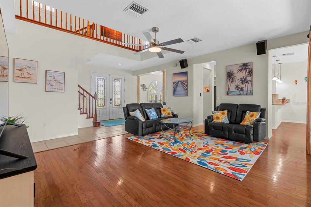 830 Golf Island Drive Apollo Beach, FL 33572 - Photo 38 of 87 a living room with furniture and a wooden floor