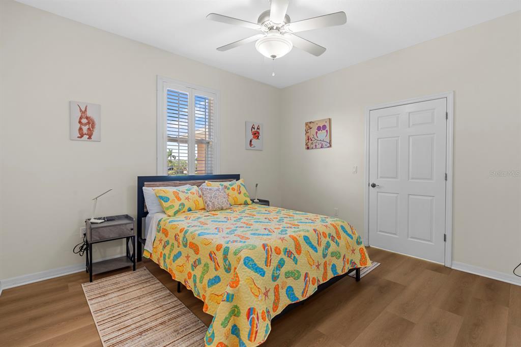 830 Golf Island Drive Apollo Beach, FL 33572 - Photo 48 of 87 a bedroom with a bed and a window