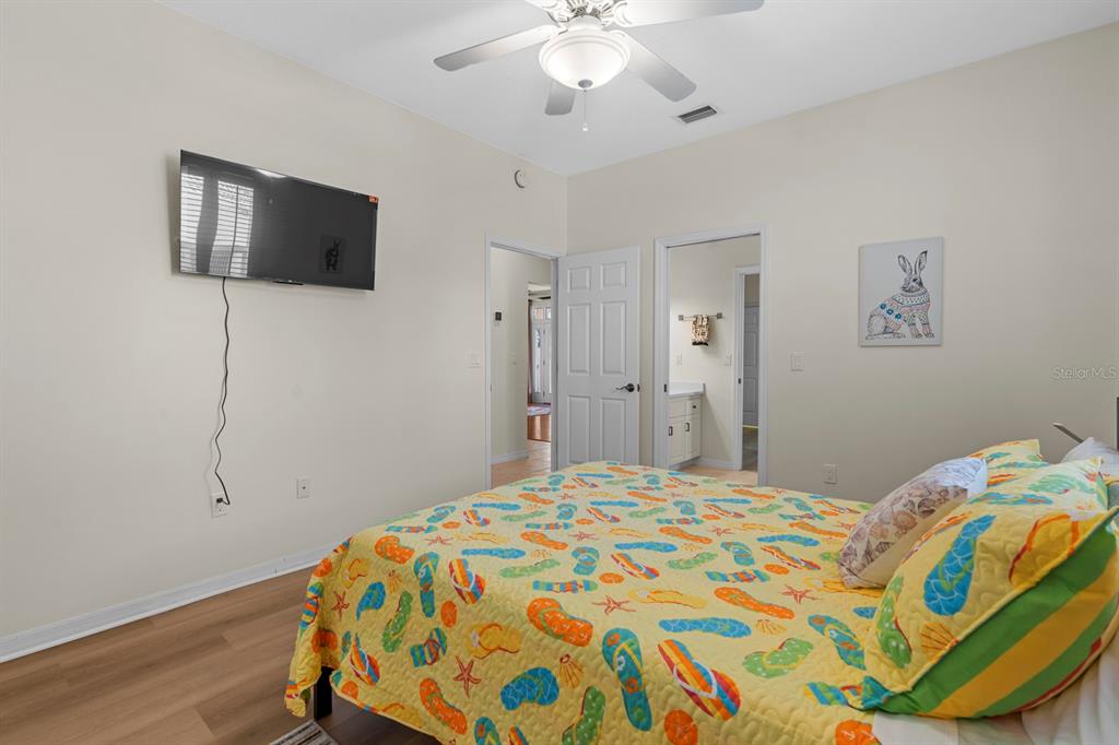 830 Golf Island Drive Apollo Beach, FL 33572 - Photo 49 of 87 a bedroom with a bed and a flat screen tv