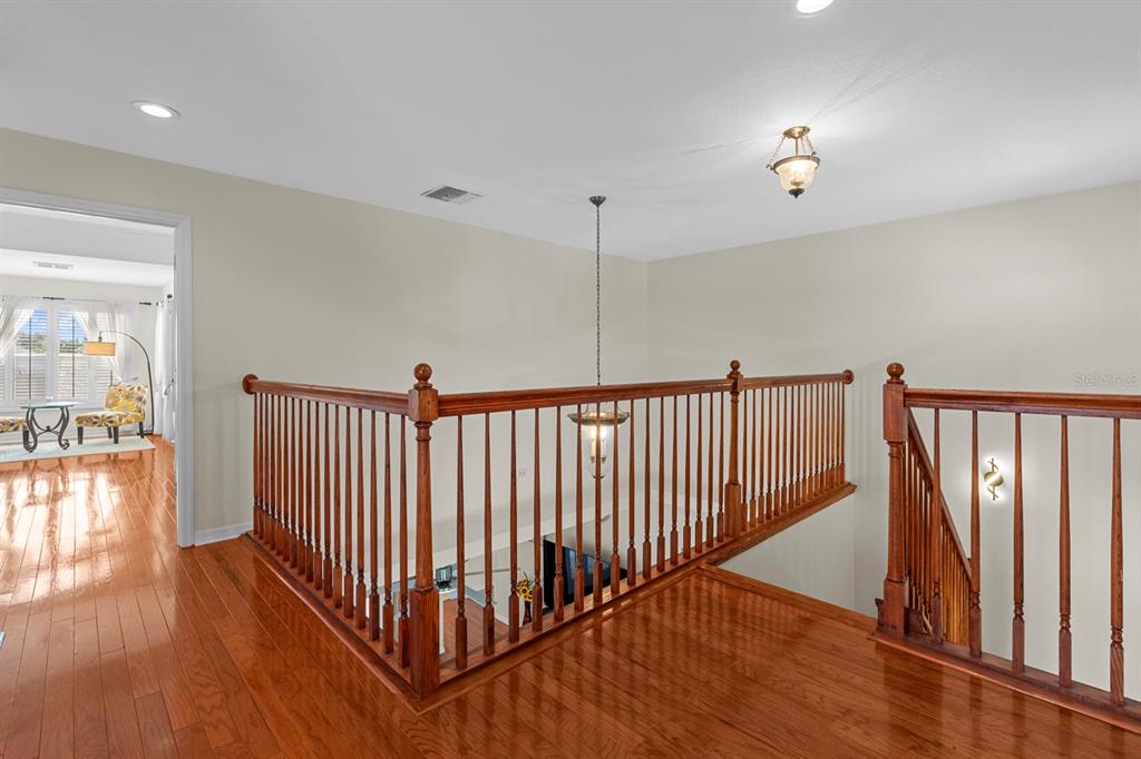 830 Golf Island Drive Apollo Beach, FL 33572 - Photo 53 of 87 a view of a hallway view with wooden floor and staircase