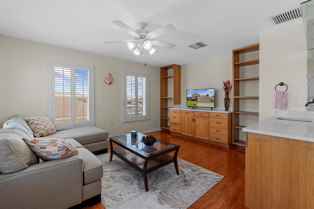 830 Golf Island Drive Apollo Beach, FL 33572 - Photo 54 of 87 a living room with furniture and a wooden floor
