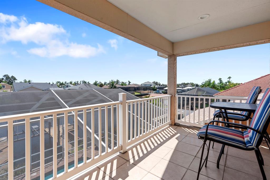 830 Golf Island Drive Apollo Beach, FL 33572 - Photo 68 of 87 a view of a city from a balcony with furniture