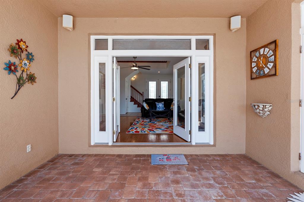 830 Golf Island Drive Apollo Beach, FL 33572 - Photo 70 of 87 a view of a hallway with wooden floor and a living room