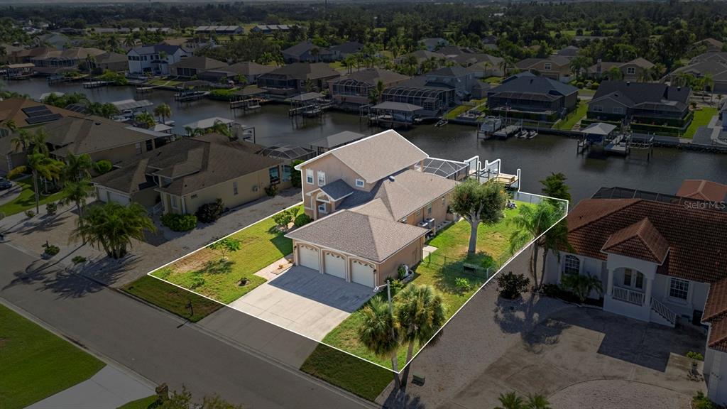 830 Golf Island Drive Apollo Beach, FL 33572 - Photo 9 of 87 an aerial view of a house with garden space and lake view