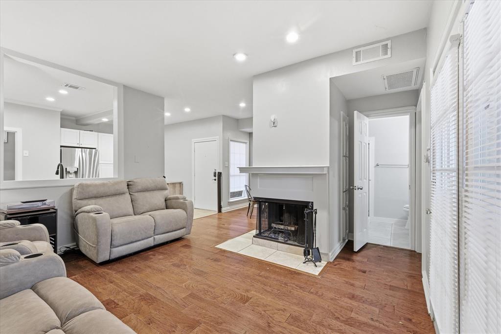 14277 Preston Road, Unit 615 Dallas, TX 75254 - Photo 7 of 20 a living room with furniture and a fireplace