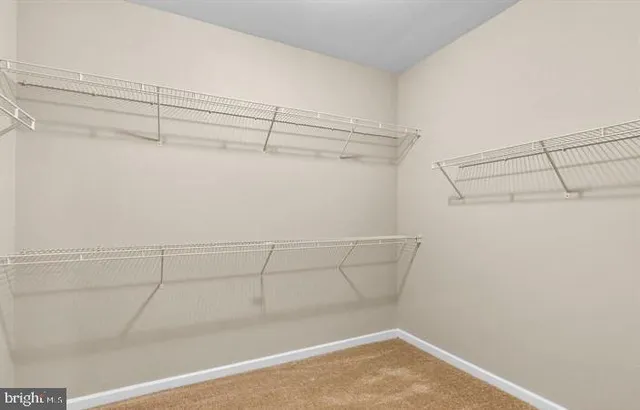 a view of a room with racks on the wall